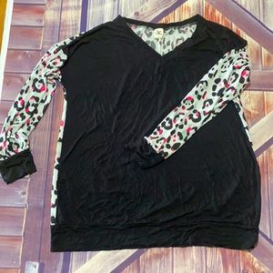 Ladies Black top with a white Leopard sheer back
